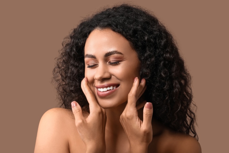 Woman Touching her face with hands